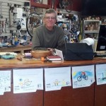 Rob Allen of Blue Heron Bikes with the winning drawings from AS&R's kids' coloring contest at the Arts & Green Festival. Blue Heron donated beautiful bike bells for all the winners so the kids really worked hard on their artwork!! Photo courtesy Amy Smolens