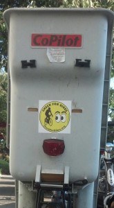 A bike child seat is the perfect place to put a "Check for Bikes" bumper sticker!